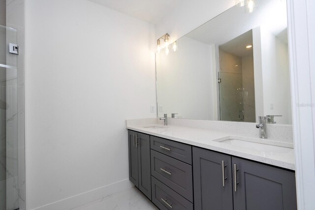 509 St Johns Ct, Poinciana, FL 34759 - bathroom featuring double vanity, baseboards, marble finish flooring, and a marble finish shower