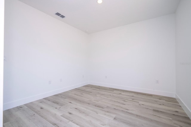 509 St Johns Ct, Poinciana, FL 34759 - unfurnished room with baseboards, light wood-style floors, and recessed lighting