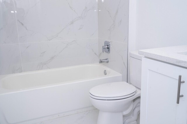509 St Johns Ct, Poinciana, FL 34759 - full bath featuring toilet, vanity, marble finish flooring, and tub / shower combination