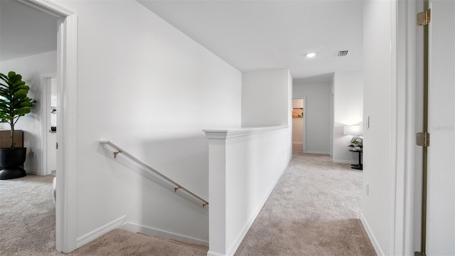 1495 Fountain View St, Ormond Beach, FL 32174 - hall featuring an upstairs landing, carpet, baseboards, and recessed lighting