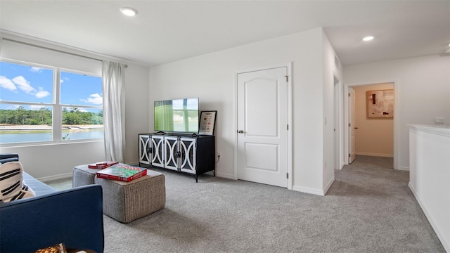 1495 Fountain View St, Ormond Beach, FL 32174 - living room featuring carpet floors, baseboards, and recessed lighting