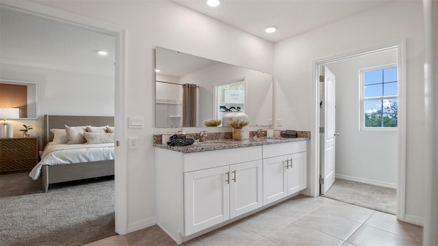 1495 Fountain View St, Ormond Beach, FL 32174 - bathroom featuring double vanity, baseboards, ensuite bath, tile patterned floors, and recessed lighting