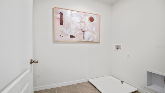 1495 Fountain View St, Ormond Beach, FL 32174 - laundry area featuring hookup for a washing machine, light tile patterned floors, baseboards, and hookup for a gas dryer