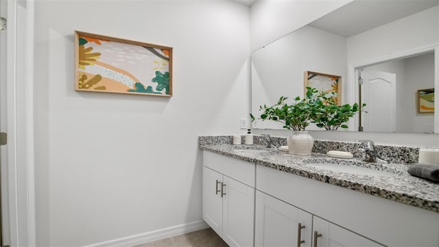 1495 Fountain View St, Ormond Beach, FL 32174 - bathroom featuring double vanity, baseboards, and tile patterned flooring