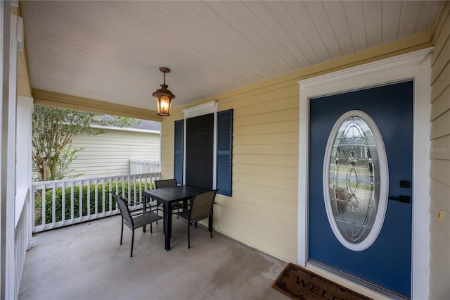 3832 NW 27th St, Gainesville, FL 32605 - property entrance featuring a porch and outdoor dining space