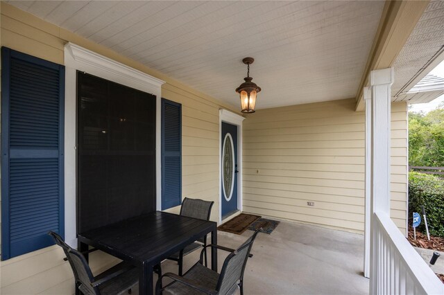 3832 NW 27th St, Gainesville, FL 32605 - covered porch with outdoor dining space
