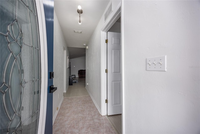3832 NW 27th St, Gainesville, FL 32605 - corridor featuring light tile patterned floors