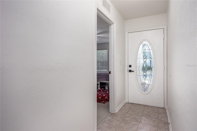 3832 NW 27th St, Gainesville, FL 32605 - foyer with baseboards and light tile patterned flooring