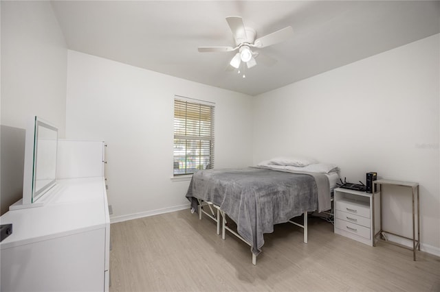 3832 NW 27th St, Gainesville, FL 32605 - bedroom with light wood finished floors, baseboards, and a ceiling fan