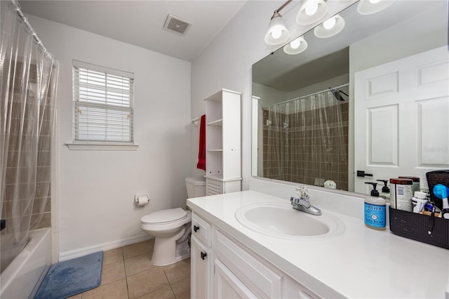 3832 NW 27th St, Gainesville, FL 32605 - bathroom featuring tile patterned floors, vanity, toilet, baseboards, and shower / bath combo