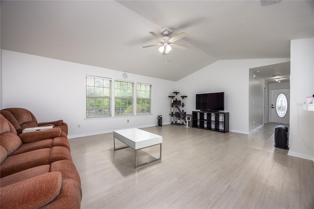 3832 NW 27th St, Gainesville, FL 32605 - living room featuring ceiling fan, lofted ceiling, plenty of natural light, light wood-style floors, and baseboards