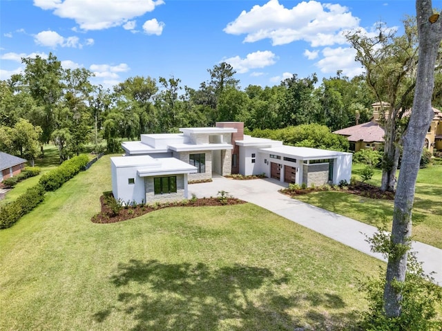 7615 SE 12th Cir, Ocala, FL 34480 - modern home with an attached garage, a front lawn, stucco siding, and concrete driveway