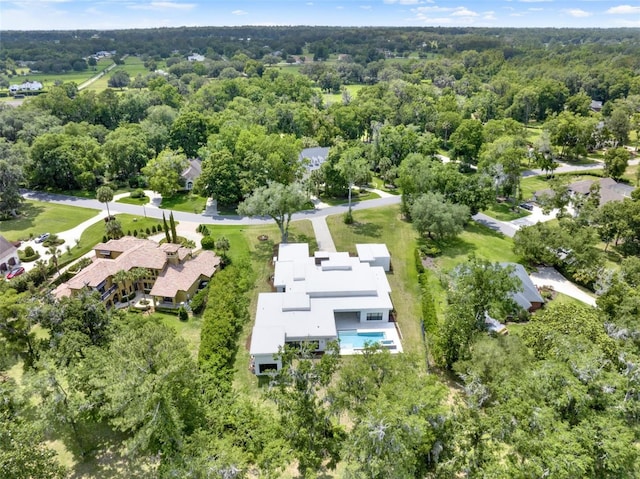 7615 SE 12th Cir, Ocala, FL 34480 - aerial overview of property's location featuring a forest