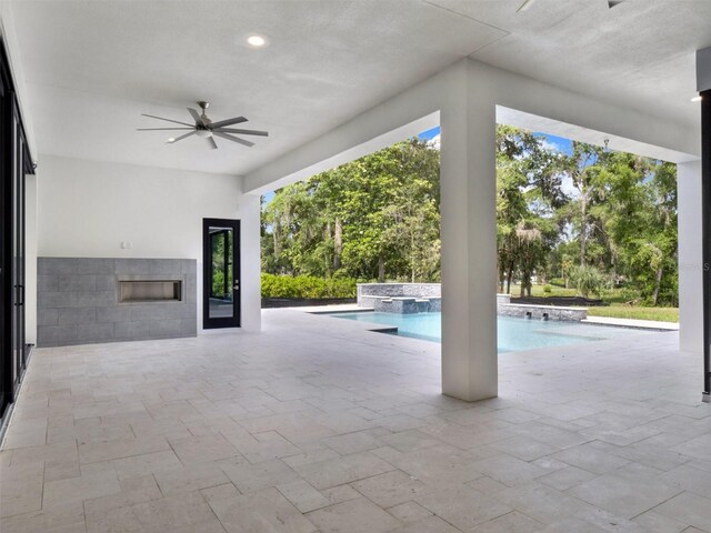 7615 SE 12th Cir, Ocala, FL 34480 - view of patio featuring ceiling fan, an outdoor pool, and an in-ground hot tub
