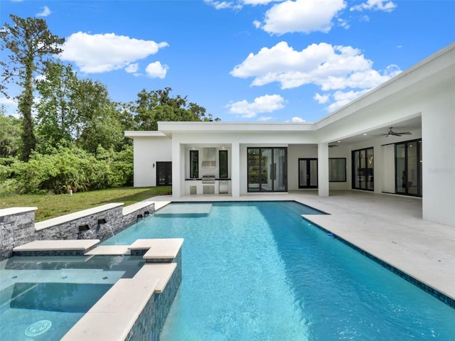7615 SE 12th Cir, Ocala, FL 34480 - view of pool with a patio area, ceiling fan, a pool with connected hot tub, french doors, and a yard