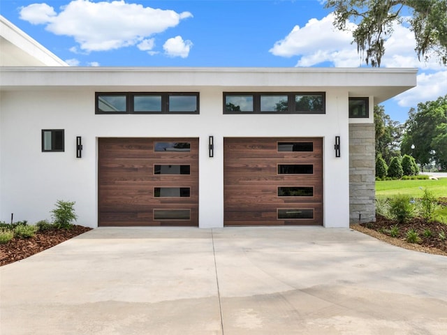 7615 SE 12th Cir, Ocala, FL 34480 - garage featuring concrete driveway