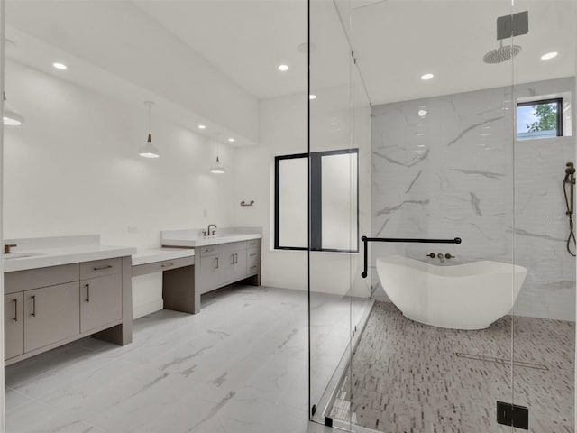 7615 SE 12th Cir, Ocala, FL 34480 - full bathroom with two vanities, recessed lighting, a marble finish shower, a freestanding bath, and marble finish floors