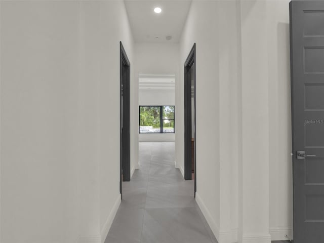 7615 SE 12th Cir, Ocala, FL 34480 - hallway with baseboards, recessed lighting, and light tile patterned flooring