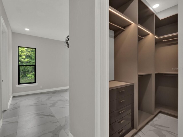 7615 SE 12th Cir, Ocala, FL 34480 - spacious closet featuring light marble finish floors