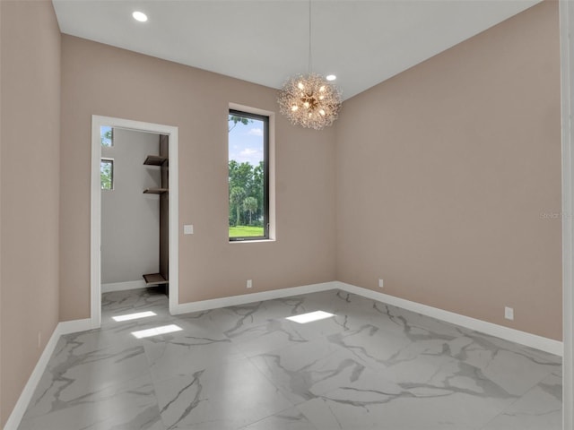 7615 SE 12th Cir, Ocala, FL 34480 - unfurnished room with marble look tiles, a chandelier, recessed lighting, and baseboards