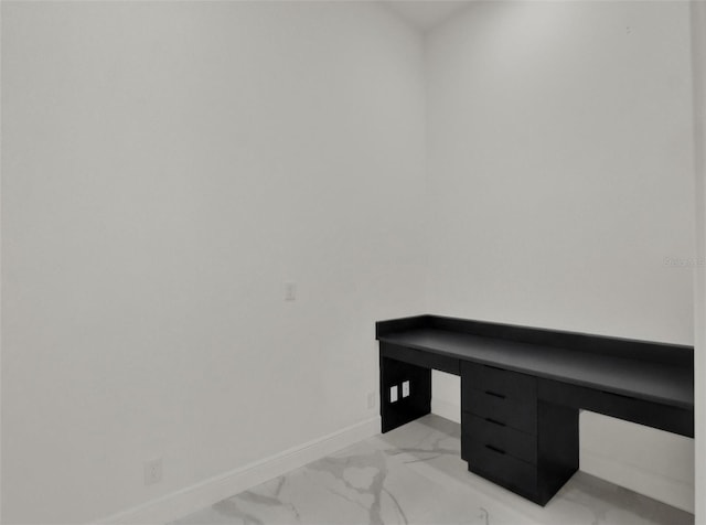 7615 SE 12th Cir, Ocala, FL 34480 - unfurnished office featuring light marble finish floors and baseboards