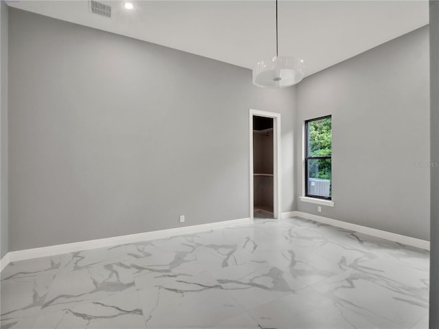 7615 SE 12th Cir, Ocala, FL 34480 - spare room with baseboards, light marble finish flooring, and recessed lighting