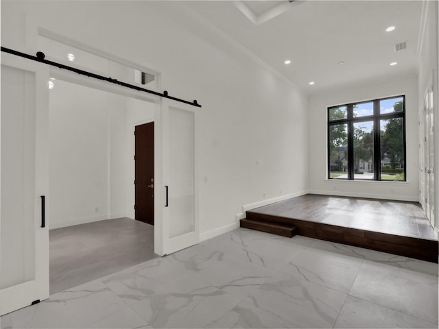 7615 SE 12th Cir, Ocala, FL 34480 - spare room with a barn door, marble look tiles, baseboards, and recessed lighting