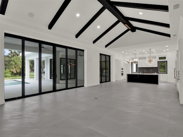7615 SE 12th Cir, Ocala, FL 34480 - unfurnished living room with a chandelier, recessed lighting, high vaulted ceiling, and beamed ceiling