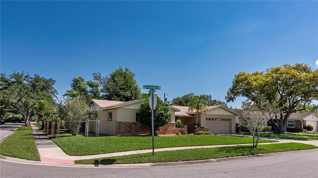 3121 Thistlehill Dr, Winter Park, FL 32792 - view of front of home with a garage, concrete driveway, and brick siding