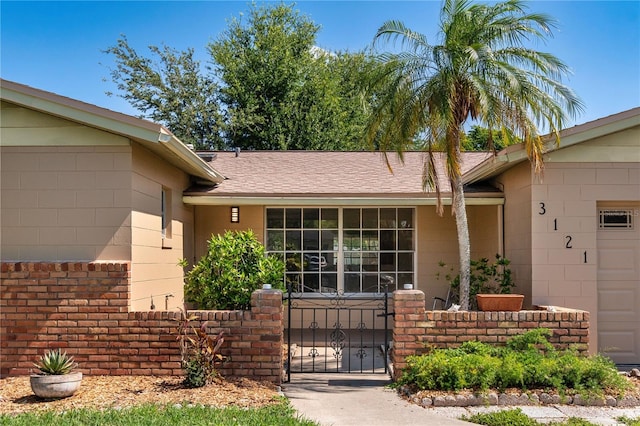 3121 Thistlehill Dr, Winter Park, FL 32792 - property entrance featuring a gate and roof with shingles