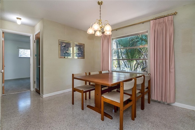 3121 Thistlehill Dr, Winter Park, FL 32792 - dining area with a chandelier, baseboards, and speckle patterned floor