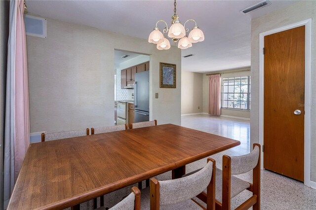 3121 Thistlehill Dr, Winter Park, FL 32792 - dining room featuring a chandelier and baseboards