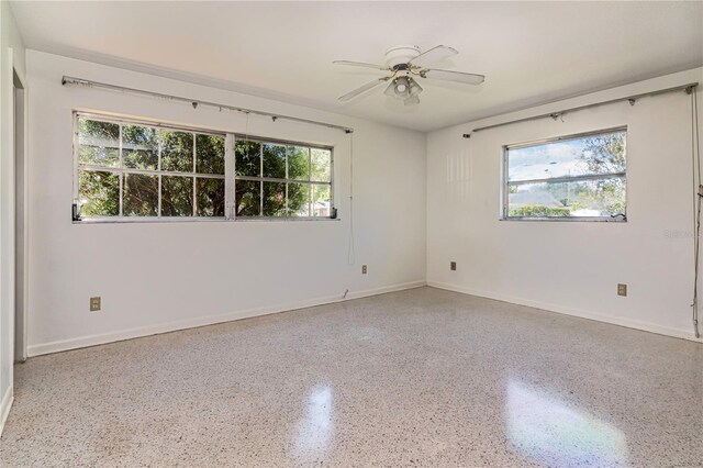 3121 Thistlehill Dr, Winter Park, FL 32792 - unfurnished room featuring speckle patterned floor, ceiling fan, and baseboards