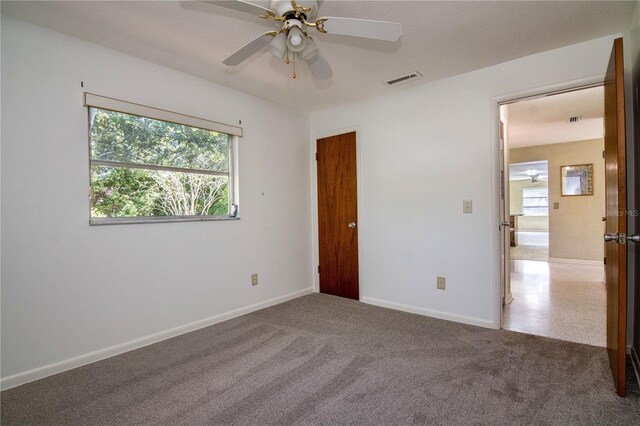 3121 Thistlehill Dr, Winter Park, FL 32792 - carpeted empty room with plenty of natural light, a ceiling fan, and baseboards