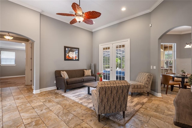 8475 Eagles Loop Cir, Windermere, FL 34786 - living room with arched walkways, french doors, a ceiling fan, crown molding, and baseboards
