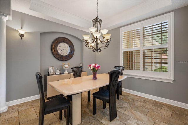 8475 Eagles Loop Cir, Windermere, FL 34786 - dining room with stone tile floors, baseboards, a chandelier, a raised ceiling, and crown molding
