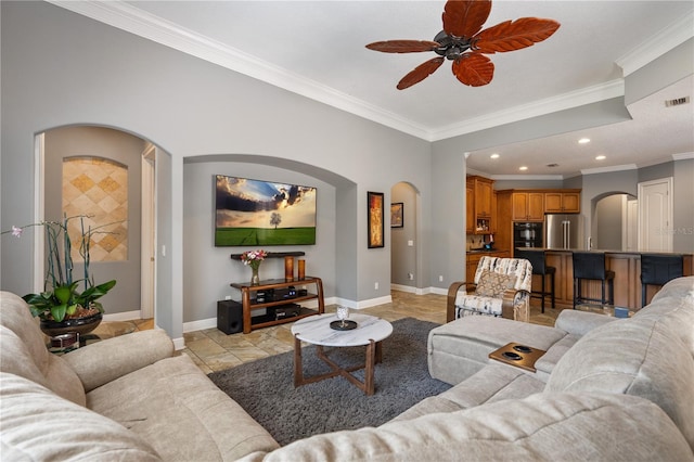 8475 Eagles Loop Cir, Windermere, FL 34786 - living area featuring arched walkways, baseboards, a ceiling fan, crown molding, and recessed lighting