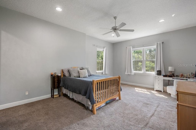 8475 Eagles Loop Cir, Windermere, FL 34786 - bedroom with light carpet, baseboards, a textured ceiling, a ceiling fan, and recessed lighting