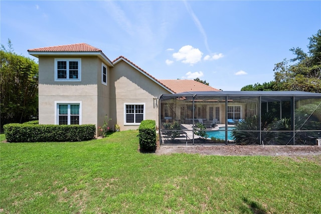 8475 Eagles Loop Cir, Windermere, FL 34786 - back of property featuring a tile roof, stucco siding, a patio area, a lawn, and an outdoor pool