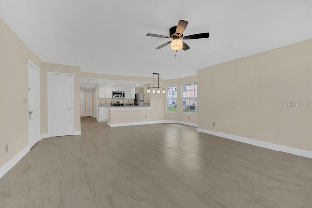 2040 Royal Bay Blvd Unit 31, Kissimmee, FL 34746 - unfurnished living room with ceiling fan and baseboards