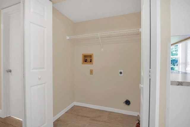 2040 Royal Bay Blvd Unit 31, Kissimmee, FL 34746 - washroom with electric dryer hookup, light marble finish flooring, baseboards, and washer hookup
