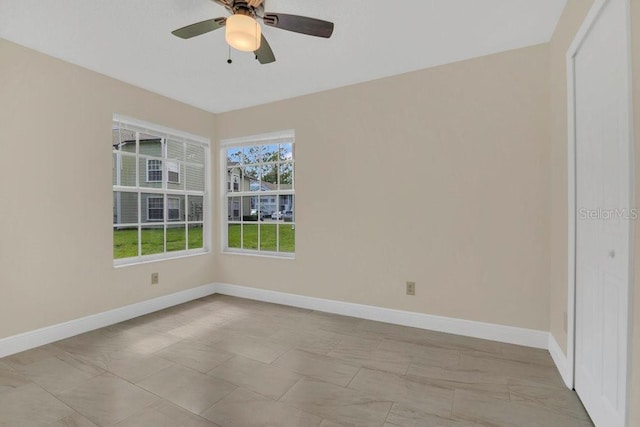 2040 Royal Bay Blvd Unit 31, Kissimmee, FL 34746 - empty room featuring baseboards and ceiling fan