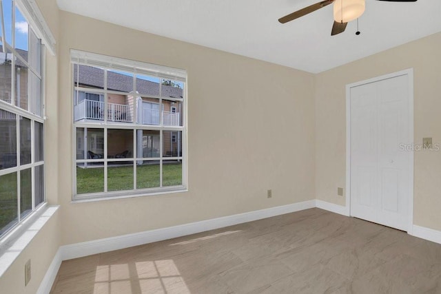 2040 Royal Bay Blvd Unit 31, Kissimmee, FL 34746 - unfurnished room featuring baseboards and a ceiling fan