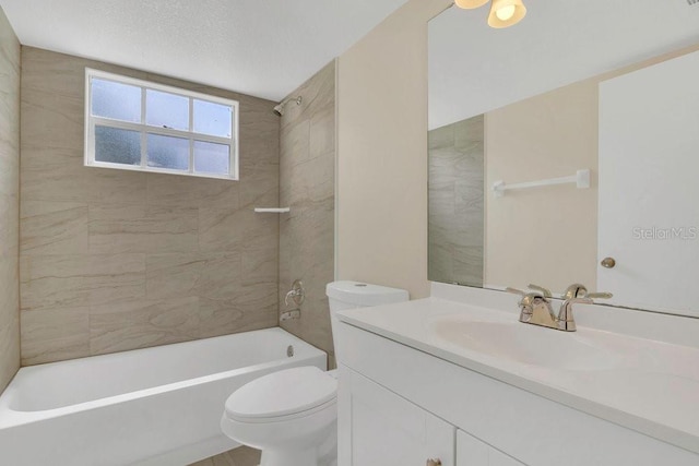 2040 Royal Bay Blvd Unit 31, Kissimmee, FL 34746 - bathroom featuring vanity, toilet, and bathing tub / shower combination