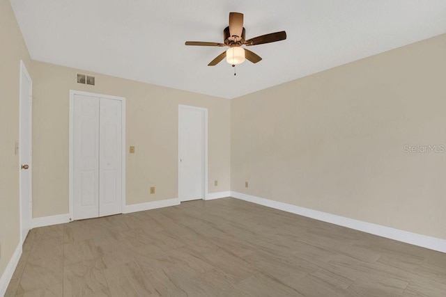 2040 Royal Bay Blvd Unit 31, Kissimmee, FL 34746 - unfurnished bedroom featuring baseboards and ceiling fan