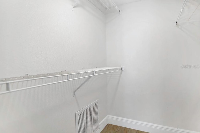 2040 Royal Bay Blvd Unit 31, Kissimmee, FL 34746 - spacious closet featuring wood finished floors