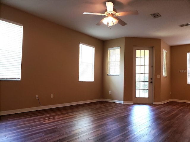3658 Oakdale Cir Unit 100, Oviedo, FL 32765 - unfurnished room featuring plenty of natural light, a ceiling fan, dark wood-style flooring, and baseboards