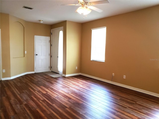 3658 Oakdale Cir Unit 100, Oviedo, FL 32765 - spare room featuring dark wood-style floors, a ceiling fan, and baseboards