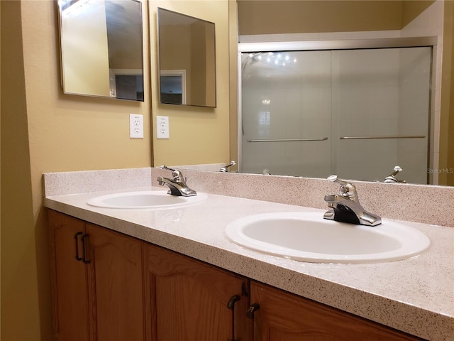3658 Oakdale Cir Unit 100, Oviedo, FL 32765 - bathroom with double vanity and a shower with shower door