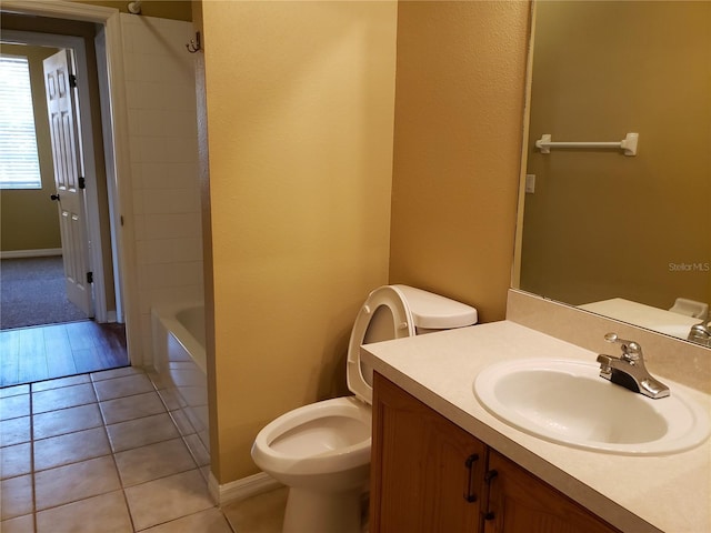 3658 Oakdale Cir Unit 100, Oviedo, FL 32765 - full bath featuring toilet, vanity, tile patterned flooring, and  shower combination